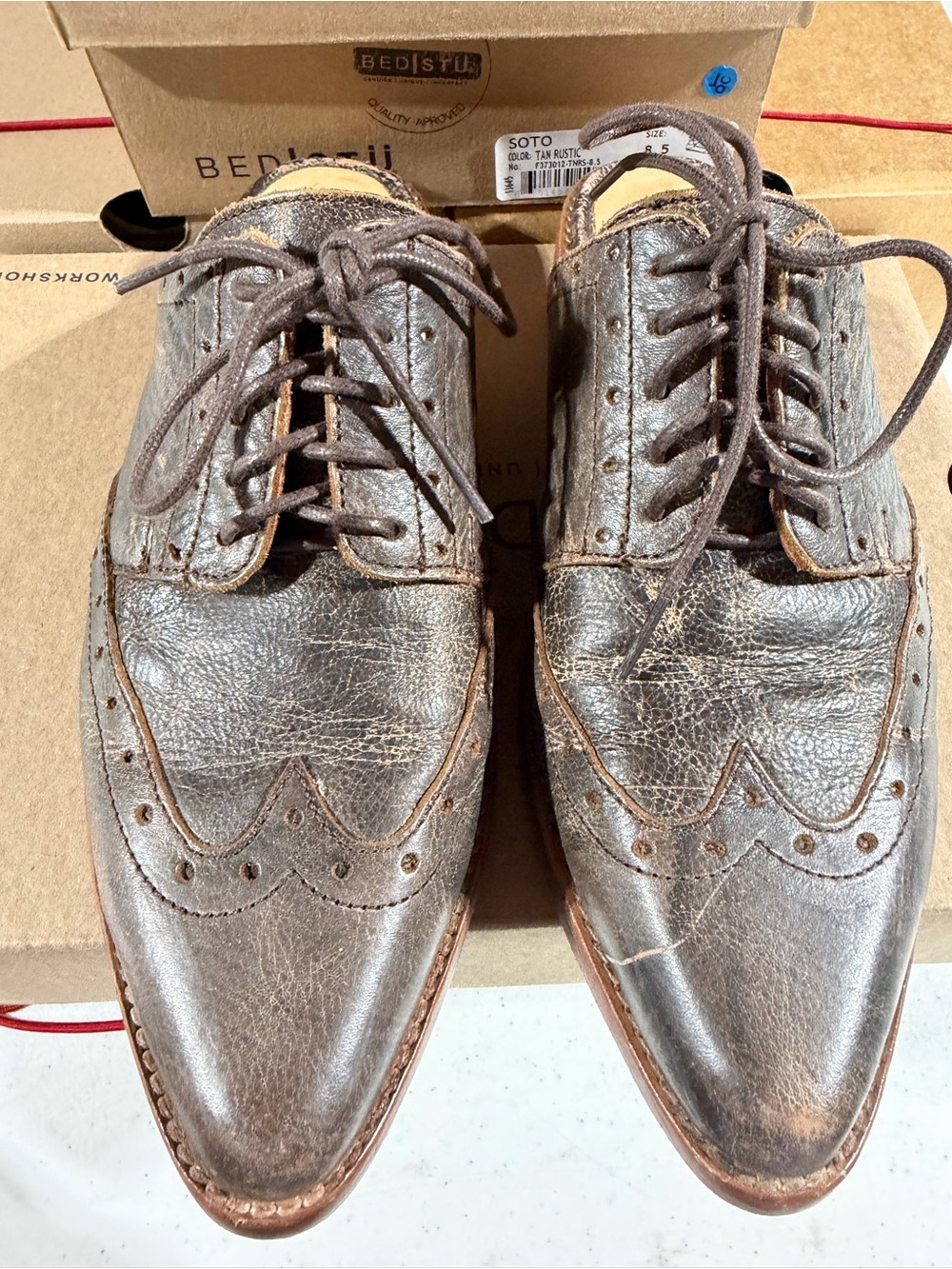 BED|STU Brown Distressed Leather Wingtip Oxford slides.